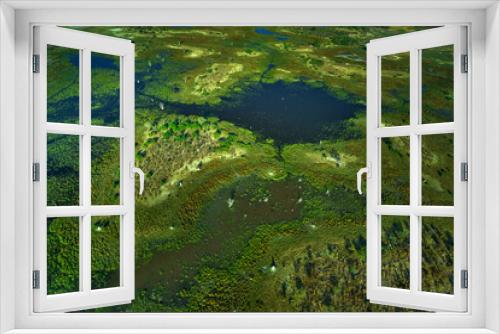 Fototapeta Naklejka Na Ścianę Okno 3D - Aerial landscape in Okavango delta, Botswana. Lakes and rivers, view from airplane. Green vegetation in South Africa. Trees with water in rainy season.