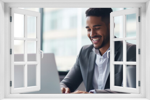 Professional male employee or a businessman using a laptop in a modern office. Copy space