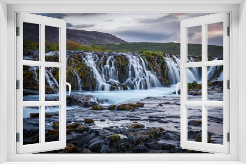 Fototapeta Naklejka Na Ścianę Okno 3D - Scenic image of Iceland. Incredible nature landscape. Stunning view of Bruarfoss Waterfall. Azure water flows over stones. Bright midnight sun of Iceland. Iceland is a most popular place of travel.
