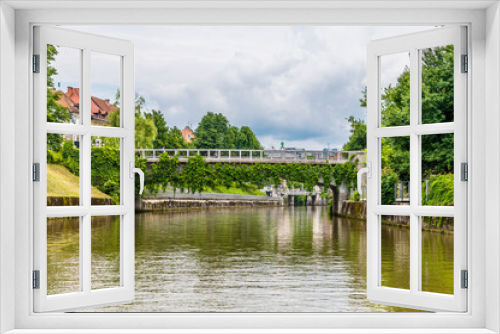 Fototapeta Naklejka Na Ścianę Okno 3D - A view on the Ljubljanica River towards the Saint James Bridge looking towards the center of Ljubljana, Slovenia in summertime