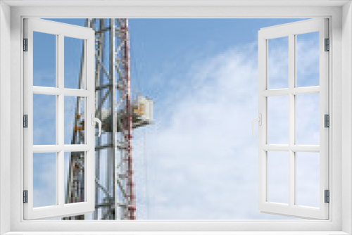 Fototapeta Naklejka Na Ścianę Okno 3D - oil drilling rig tower on blue sky