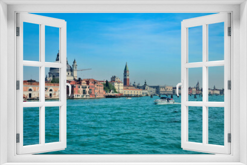 View of the Venetian Lagoon and active ship navigation on it, Venice, Italy.