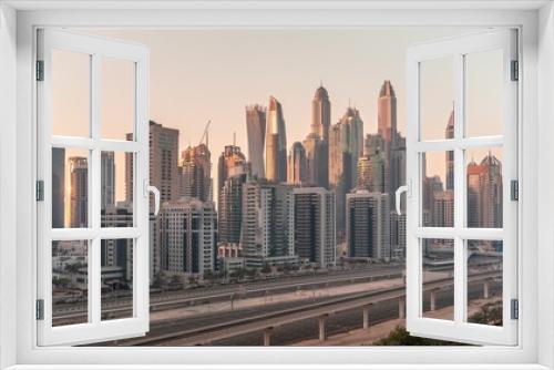 Fototapeta Naklejka Na Ścianę Okno 3D - Dubai marina tallest block of skyscrapers all day timelapse.