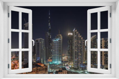 Fototapeta Naklejka Na Ścianę Okno 3D - Aerial view of Dubai Downtown skyline with many towers night timelapse.