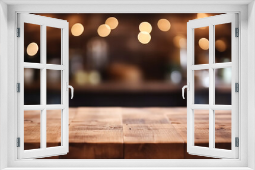 Empty wooden table top in front of abstract blurred background with garlands of lights, for product display in cafe