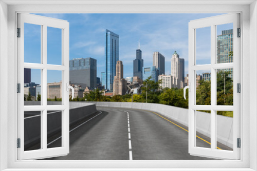 Fototapeta Naklejka Na Ścianę Okno 3D - Empty urban asphalt road exterior with city buildings background. New modern highway concrete construction. Concept of way to success. Transportation logistic industry fast delivery. Chicago. USA.