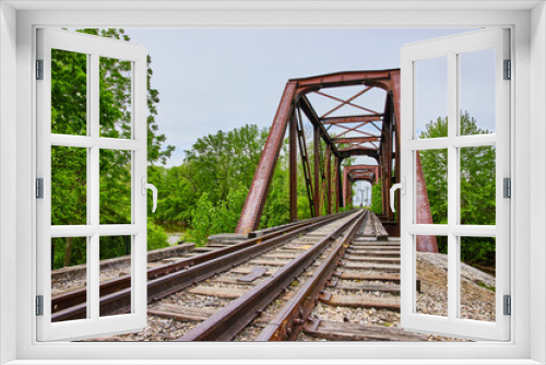 Fototapeta Naklejka Na Ścianę Okno 3D - Low view of train tracks on railroad bridge along Heart of Ohio Trail