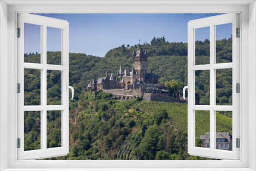 Fototapeta Naklejka Na Ścianę Okno 3D - The old German medieval castle with the name Reichsburg Cochem in the hills near the town of Cochem on the river named Mosel, in the state of Rheinland-Pfalz