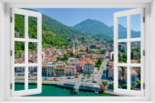 Fototapeta Naklejka Na Ścianę Okno 3D - Porlezza town, Lugano Lake. Aerial panoramic photo of town in Lugano Lake between Switzerland and Lombardy, Italy