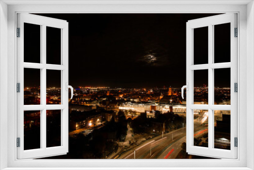 Fototapeta Naklejka Na Ścianę Okno 3D - Top down view to road. Romantic night aerial photo of cars traveling. The light on the road at night in city. Background scenic road drone view. Tram railways background