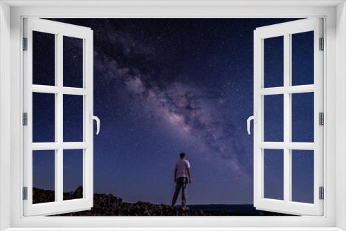 Fototapeta Naklejka Na Ścianę Okno 3D - Men / boy on the Milky Way. Stargazing at  Mauna Loa Observatory Road, Big Island Hawaii. Starry night sky,  galaxy astrophotography. 