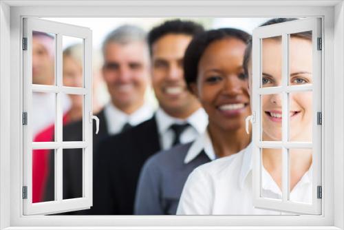 businesswoman with colleagues standing in a row