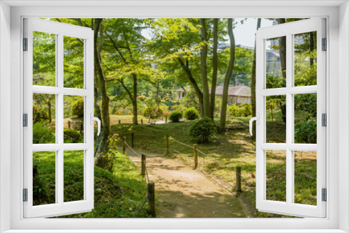 Fototapeta Naklejka Na Ścianę Okno 3D - Concrete trail through Japanese garden.