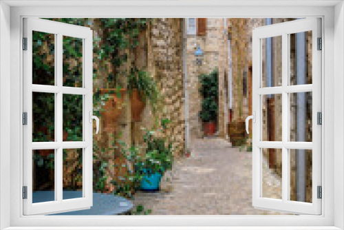 Fototapeta Naklejka Na Ścianę Okno 3D - Traditional old stone houses on a narrow street in the medieval town of Saint Paul de Vence, French Riviera, South of France
