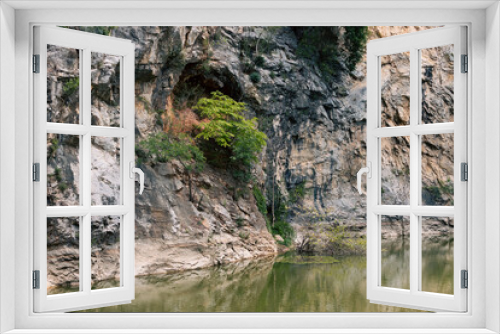 Fototapeta Naklejka Na Ścianę Okno 3D - Explore a deep cliff-high canyon in an old, flooded mine.