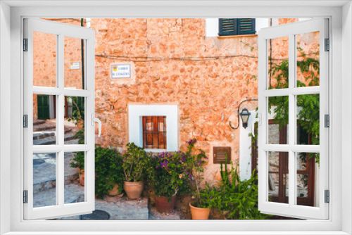Fototapeta Naklejka Na Ścianę Okno 3D - View of a medieval street in the Old Town of the picturesque Spanish-style village Fornalutx, Majorca or Mallorca island