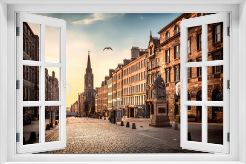 Fototapeta Naklejka Na Ścianę Okno 3D - The view of the Royal Mile and the Adam Smith Statue in the sunrise hours