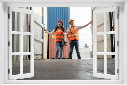 view from inside the container Male and female engineers checking goods