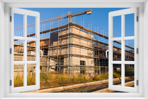 Fototapeta Naklejka Na Ścianę Okno 3D - New industrial building with scaffolding