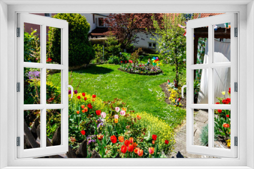 Fototapeta Naklejka Na Ścianę Okno 3D - Private garden of a house with colorful flowers