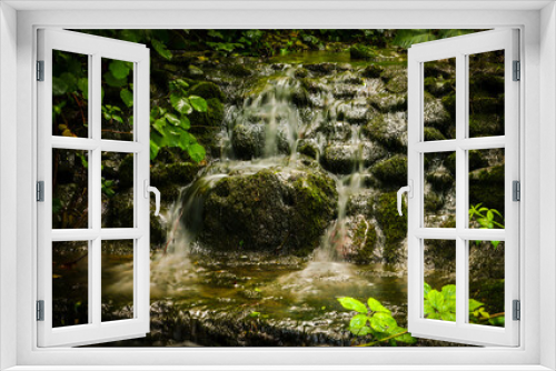 Fototapeta Naklejka Na Ścianę Okno 3D - long exposure of a waterfall with rocks