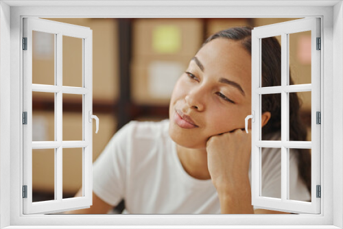 African american woman ecommerce business worker sitting on table thinking at office