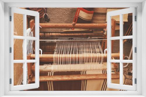 Fototapeta Naklejka Na Ścianę Okno 3D - A closeup image of an old weaving Loom in a street market