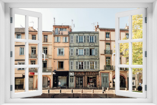 Fototapeta Naklejka Na Ścianę Okno 3D - Facade or exterior of historic traditional houses in the old city of Toulouse, France