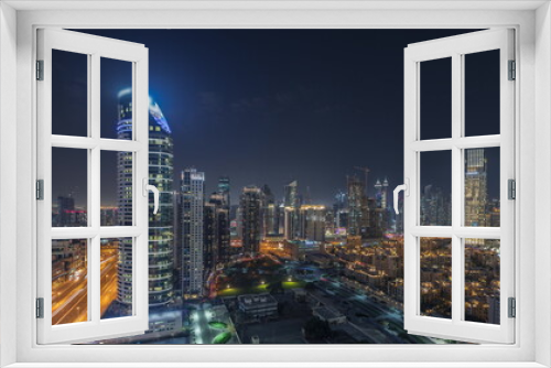 Fototapeta Naklejka Na Ścianę Okno 3D - Panorama showing Dubai Downtown and business bay night with tallest skyscraper and other towers