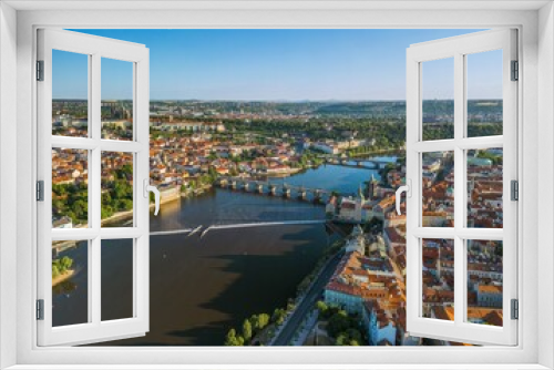 Fototapeta Naklejka Na Ścianę Okno 3D - The drone aerial panoramic view of River Vltava runs through Prague city at sunrise, Czech Republic.	