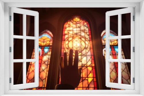 A hand clutching a summons stands against an illuminated stained glass window of a courthouse symbolizing the power of justice.