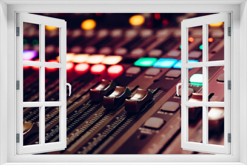A detailed view of a sound mixing console