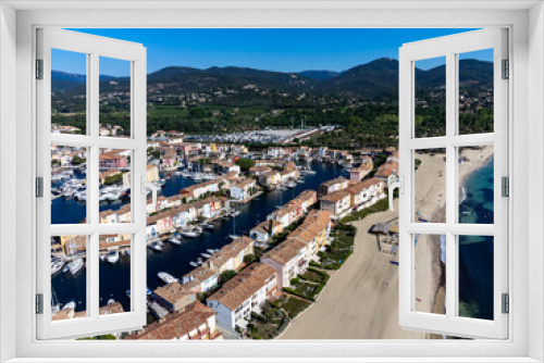 Fototapeta Naklejka Na Ścianę Okno 3D - Arial view on blue water of Gulf of Saint-Tropez, sandy beach, houses in Port Grimaud, village on Mediterranean sea with yacht harbour, Provence, summer in France