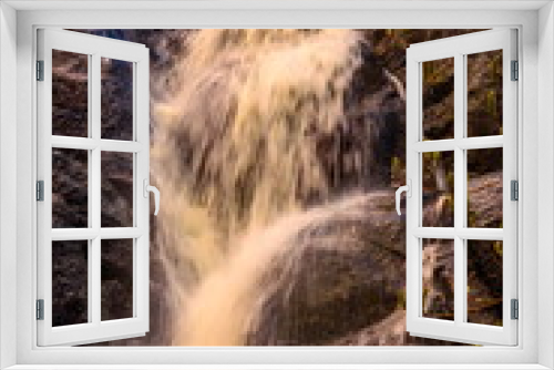 Fototapeta Naklejka Na Ścianę Okno 3D - picturesque waterfall on a stream running from the mountains along a ravine on a spring day
