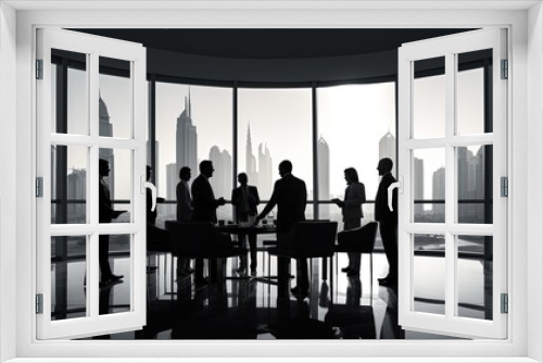 Business individuals are having a black and white conversation in Dubai to form a partnership agreement. silhouette concept