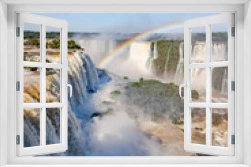 Fototapeta Naklejka Na Ścianę Okno 3D - Perfect rainbow over Iguazu Waterfalls, one of the new seven natural wonders of the world in all its beauty viewed from the Brazilian side - traveling South America 