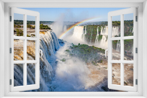 Fototapeta Naklejka Na Ścianę Okno 3D - Perfect rainbow over Iguazu Waterfalls, one of the new seven natural wonders of the world in all its beauty viewed from the Brazilian side - traveling South America 