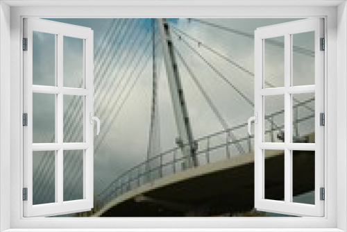 Fototapeta Naklejka Na Ścianę Okno 3D - Low angle of the Chords Bridge, the Bridge of Strings in Jerusalem against the cloudy blue sky