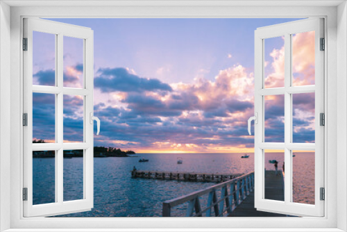 Fototapeta Naklejka Na Ścianę Okno 3D - Dramatic View to the Wooden Pier in the Sunset light, Guadeloupe
