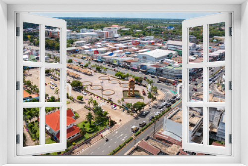 Fototapeta Naklejka Na Ścianę Okno 3D - Aerial view of square landmark monument with residential neighborhood roofs. Urban housing development from above. Top view. Real estate in Isan urban city town, Thailand. Property real estate.