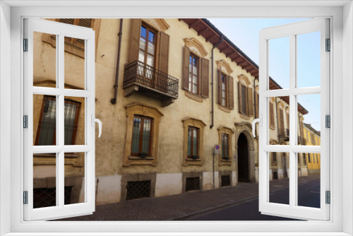 Fototapeta Naklejka Na Ścianę Okno 3D - Old buildings along via Archinti in Lodi, Italy