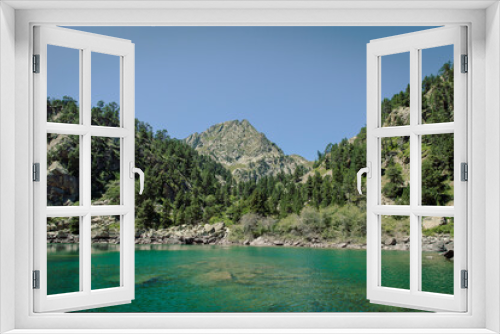 Fototapeta Naklejka Na Ścianę Okno 3D - Beautiful idyllic lake next to a mountain during a summer day