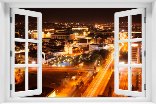 Fototapeta Naklejka Na Ścianę Okno 3D - Top view of the night city, lights of lamps and cars in the dark