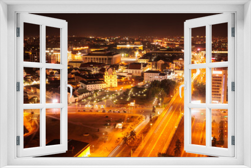 Fototapeta Naklejka Na Ścianę Okno 3D - Top view of the night city, lights of lamps and cars in the dark