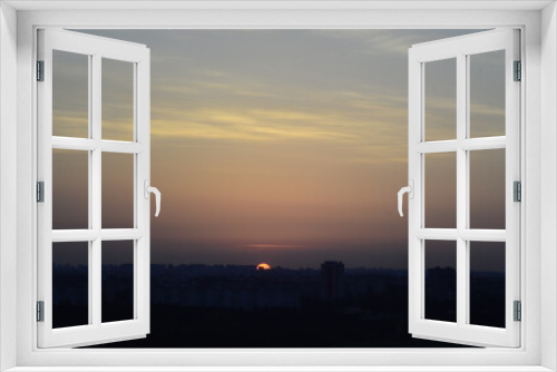 Fototapeta Naklejka Na Ścianę Okno 3D - sunset over the city