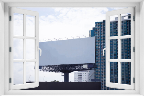 Fototapeta Naklejka Na Ścianę Okno 3D - Large blank outdoor billboard with sky background. Promotional information for announcements and marketing details