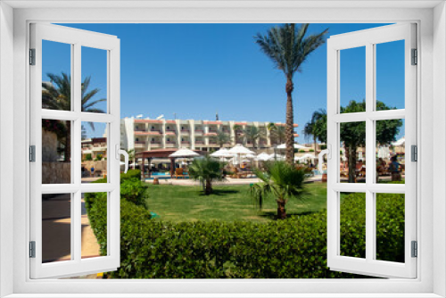 Fototapeta Naklejka Na Ścianę Okno 3D - Beautiful view of the Egyptian hotel with palm trees, flowers and a swimming pool