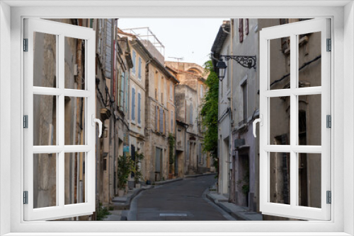 Fototapeta Naklejka Na Ścianę Okno 3D - View on old streets and houses in ancient french town Arles, touristic destination with Roman ruines, Bouches-du-Rhone, France