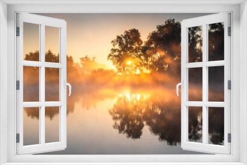 Fototapeta Naklejka Na Ścianę Okno 3D - Misty sunrise over calm lake