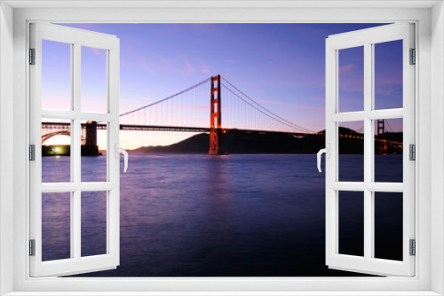 Fototapeta Naklejka Na Ścianę Okno 3D - South tower of Golden Gate Bridge glows and beautiful sunset sky